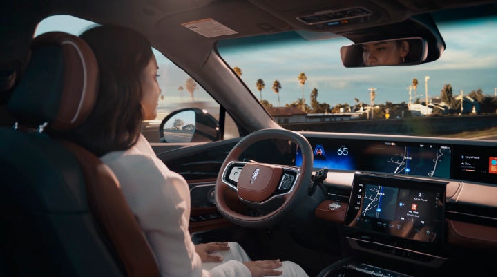 A person is shown driving hands-free on the highway with available Lincoln BlueCruise technology. | Fair Oaks Lincoln in Naperville IL